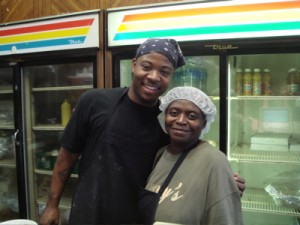 henrys-tay Tay, left, fries the chicken hot and fresh to order