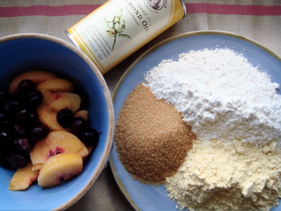 summer cake frozen peaches and cherries, La Tourangelle almond oil, yellow cornmeal, raw cane sugar, and ap flour